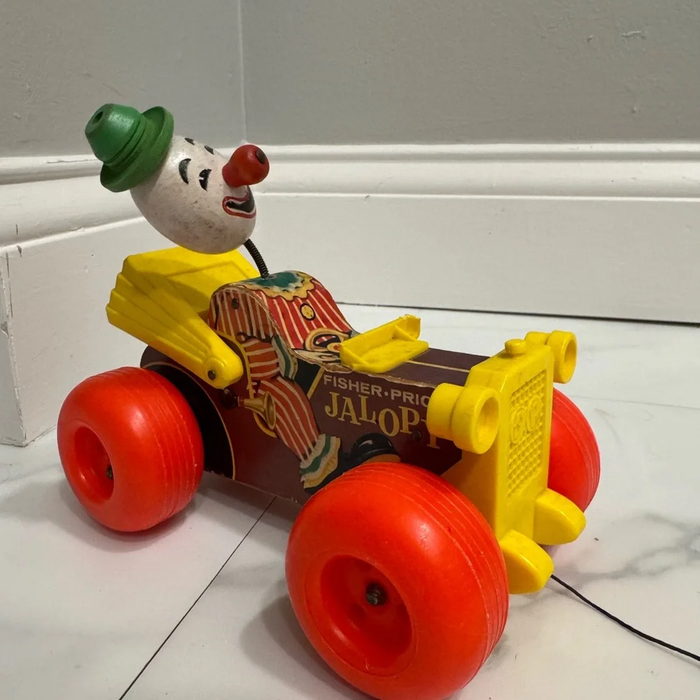 Vintage Fisher Price Jolly Jallopy pull toy from 1974.